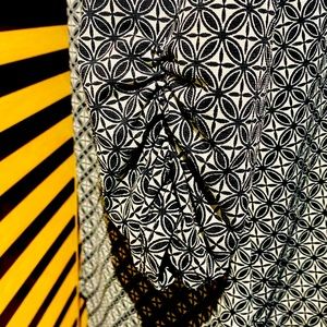 Naïf- women’s black and white 1x gentle used top with mid- sleeve . Non -smoker